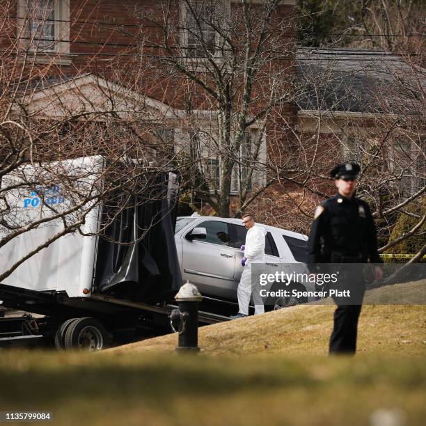 The truck reported to have been owned by reputed mob boss Francesco “Franky Boy” Cali is removed from in front of his home after he was gunned down...