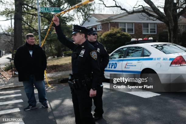 Police stand near where reputed mob boss Francesco “Franky Boy” Cali lived and was gunned down on March 14, 2019 in the Todt Hill neighborhood of the...