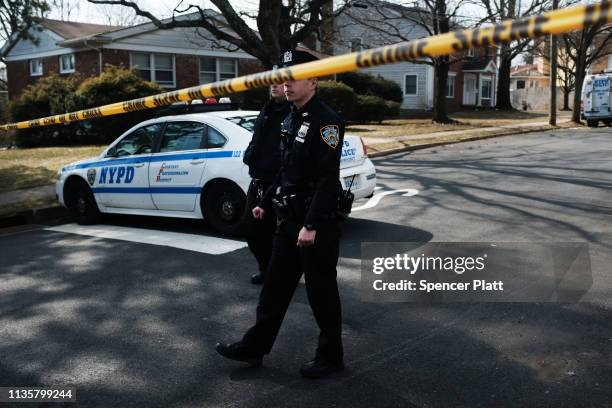 Police stand near where reputed mob boss Francesco “Franky Boy” Cali lived and was gunned down on March 14, 2019 in the Todt Hill neighborhood of the...