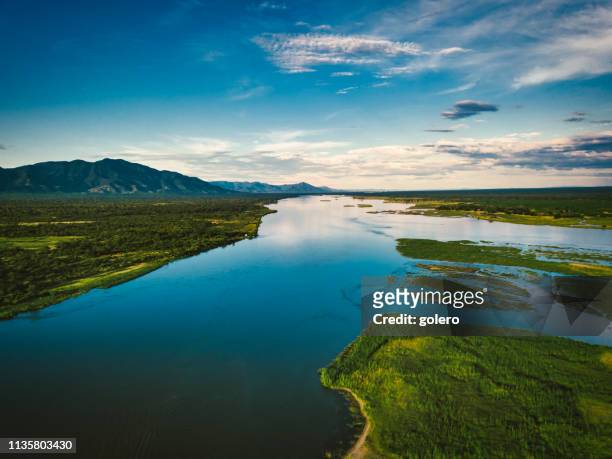 aerial view on the zambezi under blue sky - zambezi river stock pictures, royalty-free photos & images