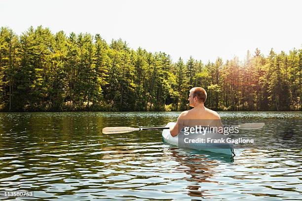 man relaxing in a kayak. - lake solitude (new hampshire) fotografías e imágenes de stock