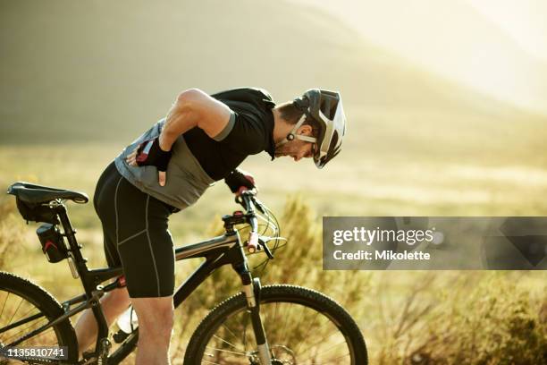 i should have stretched more - biking athletic stock pictures, royalty-free photos & images