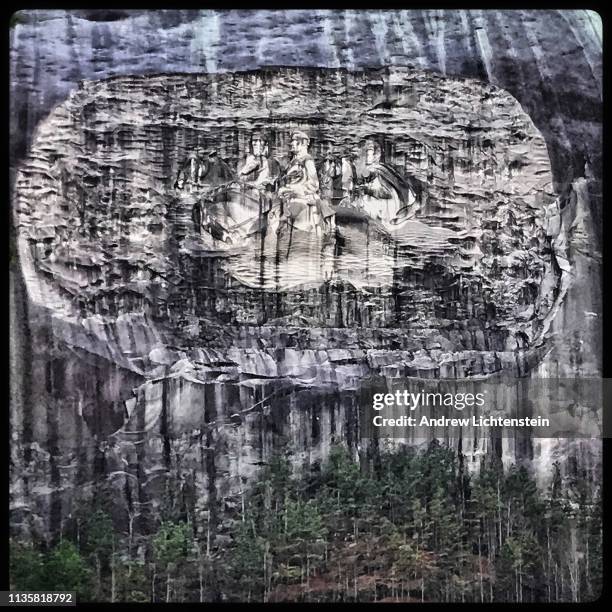Giant rock face has images of three Confederate generals carved in it as a tribute to cause of the Southern army during the Civil War, as seen on...