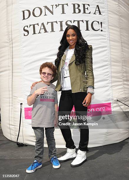 Keenan Cahill and recording artist Ciara perform in honor of National Teen Pregnancy Awareness Month in Times Square on May 3, 2011 in New York City.