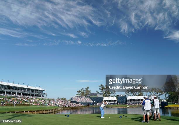 Justin Thomas of the United States plays his tee shot on the par 3, 17th hole during the first round of the 2019 Players Championship held on the...