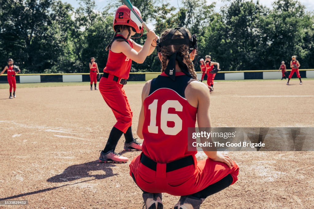 Girls softball team practicing on field