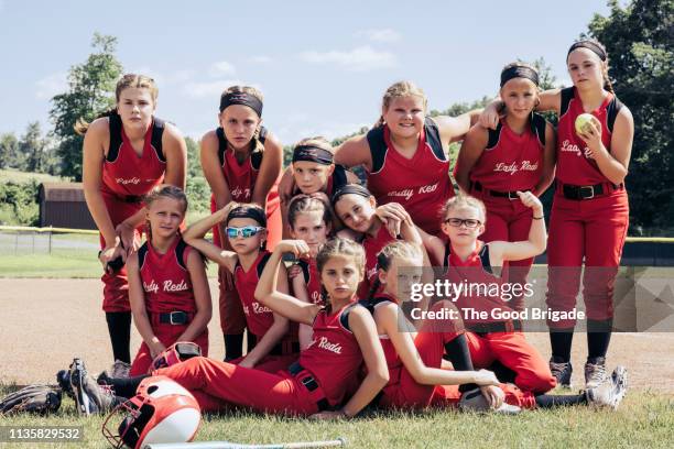 portrait of girl's softball team on field - softball sport bildbanksfoton och bilder