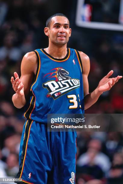Grant Hill of the Detroit Pistons shoots the ball against the Philadelphia 76ers on February 9, 1999 at the First Union Center in Philadelphia,...