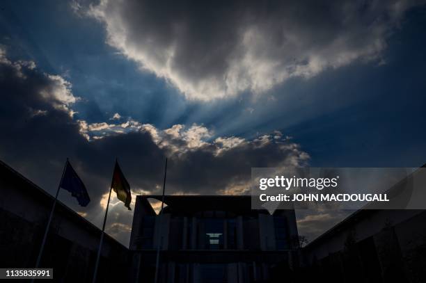 Clouds gather over the chancellery building in Berlin on April 8, 2019.