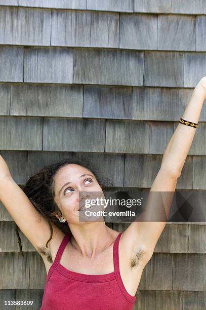 woman with hairy armpits - female hairy arms stock pictures, royalty-free photos & images