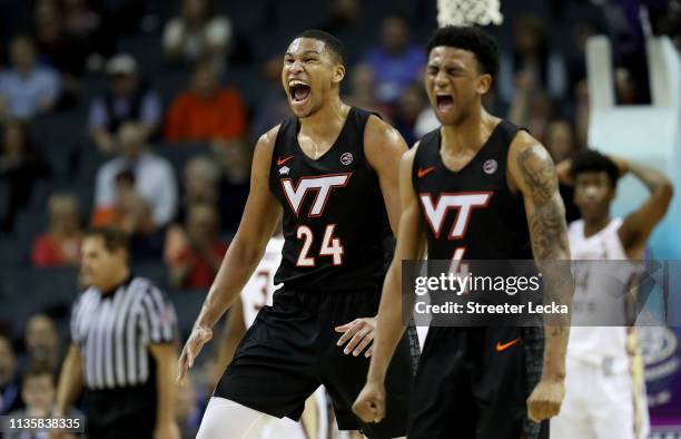 Teammates Kerry Blackshear Jr. #24 and Nickeil Alexander-Walker of the Virginia Tech Hokies react against the Florida State Seminoles during their...