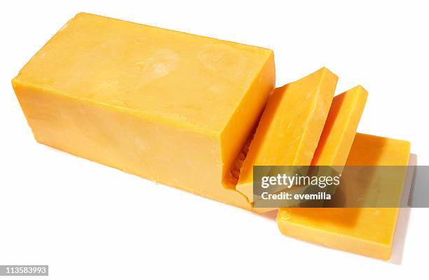 cheddar cheese being cut on white background - block shape stock pictures, royalty-free photos & images