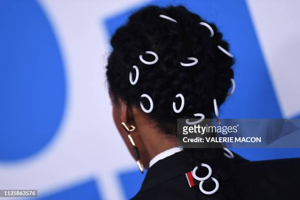 Singer Janelle Monae's hair is shown as she arrives for the premiere of Universal Pictures' "Little" at the Regency Village Theatre in Los Angeles on...