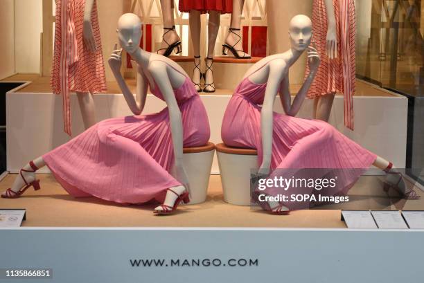 Close view of the mango cloth store window display in Madrid.