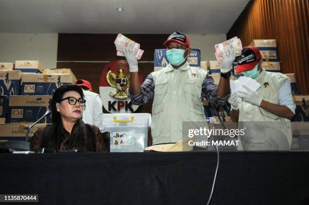 This picture taken on March 28, 2019 shows Basariah Panjaitan , deputy chairperson of the corruption eradication commission , seated alongside KPK...