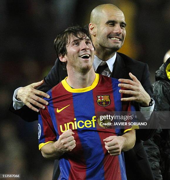 Barcelona's coach Josep Guardiola celebrates with Barcelona's Argentinian forward Lionel Messi after the Champions League semi-final second leg...