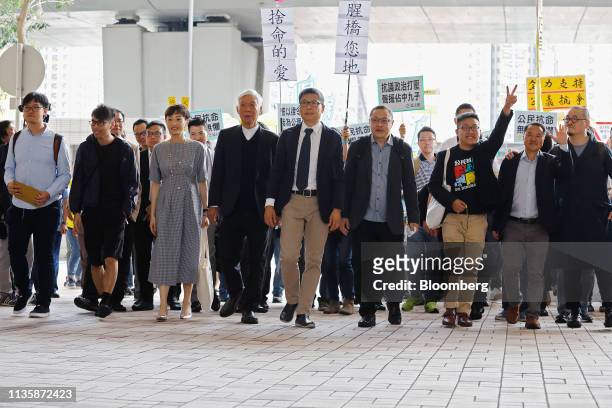 Members of the so-called "Umbrella Nine" democracy activists Tommy Cheung Sau-yin, from left, Eason Chung Yiu-wa, Tanya Chan, Chu Yiu-ming, Chan...