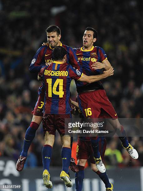 Gerad Pique , Javier Mascherano and Sergio Busquets of FC Barcelona celebrate after defeating Real Madrid at the end of the UEFA Champions League...