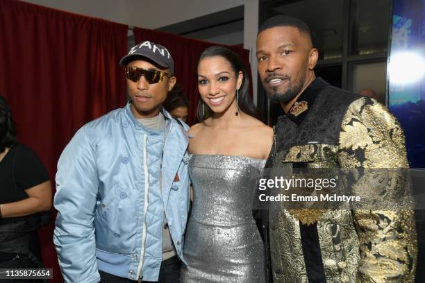 Pharrell Williams, Corinne Foxx and Jamie Foxx attend the 2019 iHeartRadio Music Awards which broadcasted live on FOX at Microsoft Theater on March...