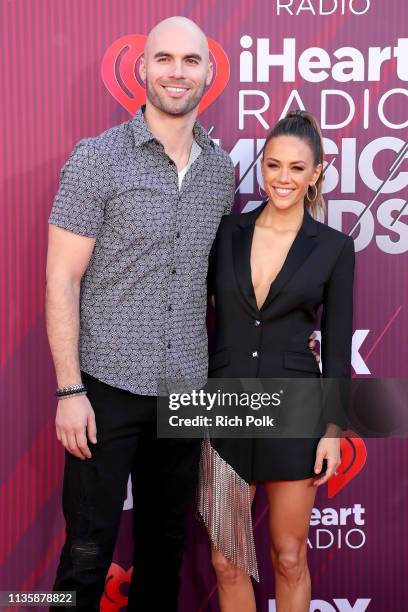 Mike Caussin and Jana Kramer attend the 2019 iHeartRadio Music Awards which broadcasted live on FOX at Microsoft Theater on March 14, 2019 in Los...