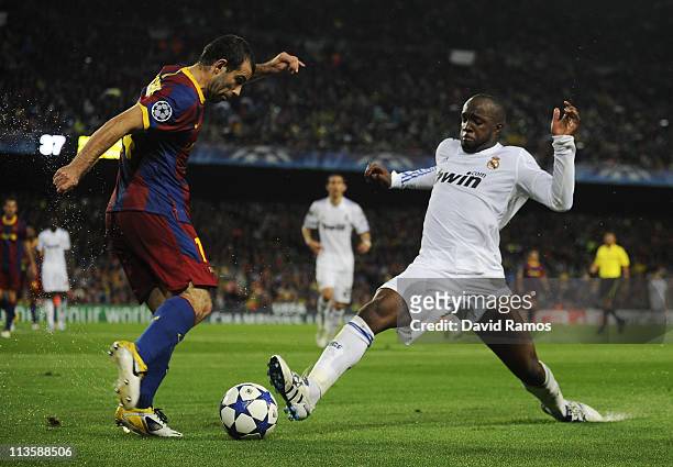 Javier Mascherano of FC Barcelona fights for the ball against Lass Diarra of Real Madrid during the UEFA Champions League Semi Final second leg match...