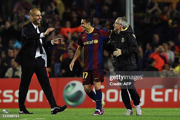 Barcelona's coach Josep Guardiola and Barcelona's forward Pedro Rodriguez celebrate after winning the Champions League semi-final second leg football...