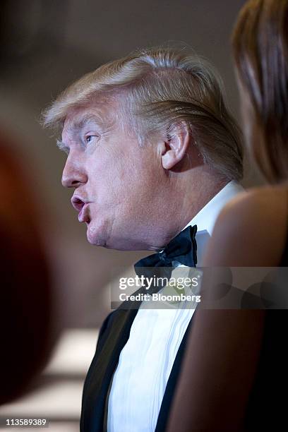 Donald Trump talks with the media at the White House Correspondents' Association dinner in Washington, D.C., U.S., on Saturday, April 30, 2011. The...