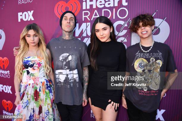 Alabama Barker, Travis Barker, Atiana De La Hoya and Landon Asher Barker attends the 2019 iHeartRadio Music Awards which broadcasted live on FOX at...