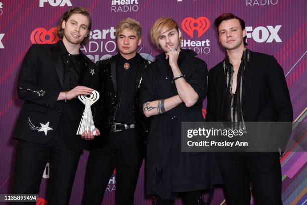 Luke Hemmings, Calum Hood, Ashton Irwin, and Michael Clifford of 5 Seconds of Summer attend the 2019 iHeartRadio Music Awards which broadcasted live...