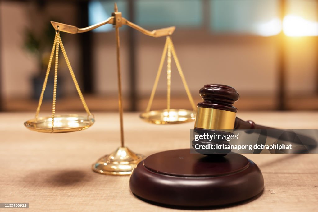 Justice Scales and books and wooden gavel
