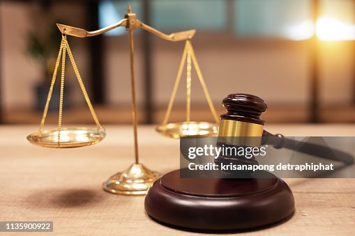 Justice Scales and books and wooden gavel Justice Scales and books and wooden gavel