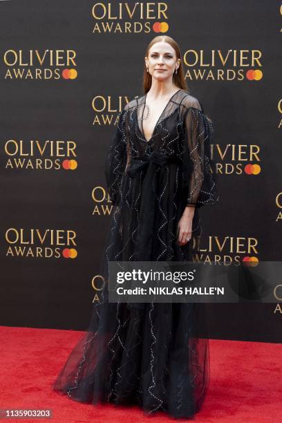 British actress Rosalie Craig poses on the red carpet upon arrival to attend The Olivier Awards at the Royal Albert Hall in central London on April...