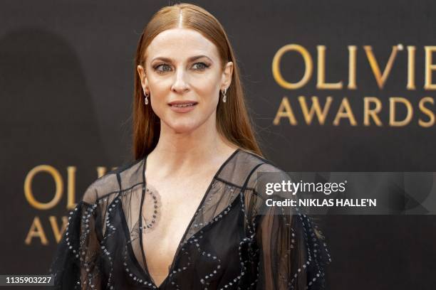 British actress Rosalie Craig poses on the red carpet upon arrival to attend The Olivier Awards at the Royal Albert Hall in central London on April...