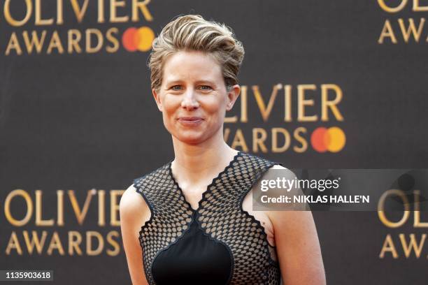 British theatre director and writer Thea Sharrock poses on the red carpet upon arrival to attend The Olivier Awards at the Royal Albert Hall in...