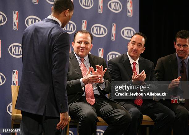 Tom Thibodeau, Gar Forman and Tom Chaney applaud Derrick Rose of the Chicago Bulls after he accepts the 2010-11 Kia NBA Most Valuable Player Award on...