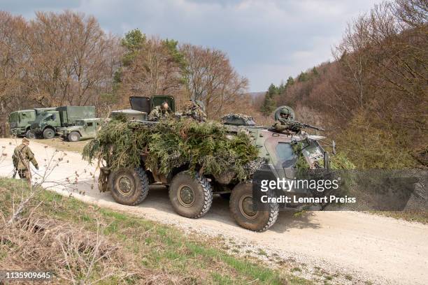 An armored transport tank Fuchs of the the German Armed Forces Bundeswehr leaves a camp during the Allied Spirit X international military exercises...