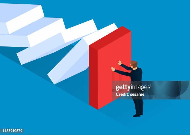 businessman trying to stop the dominoes from collapsing - dominos falling stock illustrations