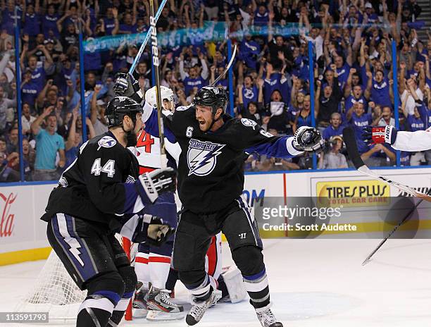 Ryan Malone of the Tampa Bay Lightning celebrates his goal with teammate Nate Thompson during the the third period against the Washington Capitals in...