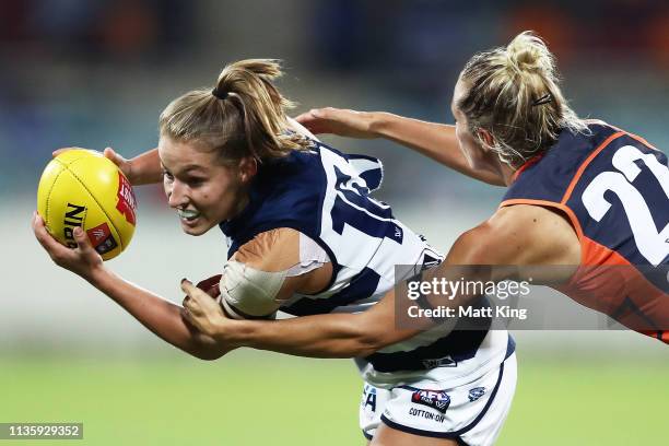 Olivia Purcell of the Cats is tackled by Elle Bennetts of the Giants during the AFL round seven match between the Greater Western Sydney Giants and...