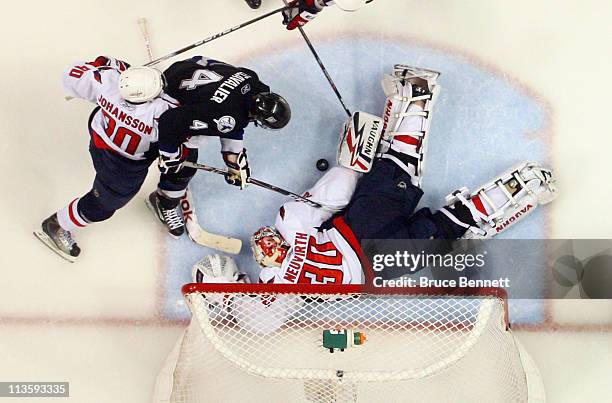 Michal Neuvirth of the Washington Capitals makes the save on Vincent Lecavalier of the Tampa Bay Lightning in Game Three of the Eastern Conference...