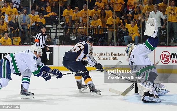 Steve Sullivan of the Nashville Predators has his shot blocked by Roberto Luongo of the Vancouver Canucks in Game Three of the Western Conference...