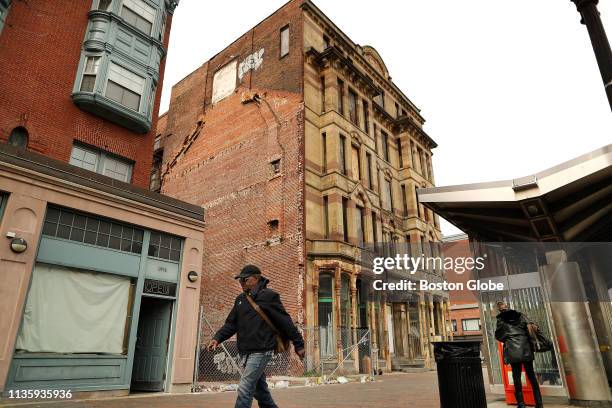 The shuttered Alexandra Hotel building, which has been in disrepair for years, is pictured at the corner of Washington Street and Massachusetts...