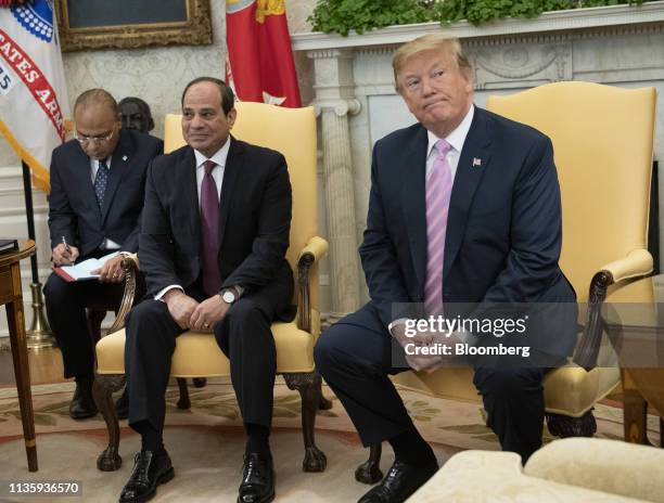 President Donald Trump, right, and Abdel-Fattah El-Sisi, Egypt's president, center, sit during a meeting at the Oval Office of the White House in...