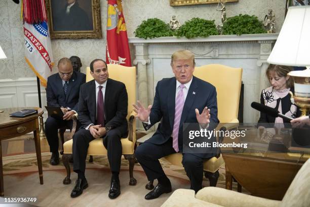 President Donald Trump, second right, speaks as Abdel-Fattah El-Sisi, Egypt's president, second left, listens during a meeting at the Oval Office of...