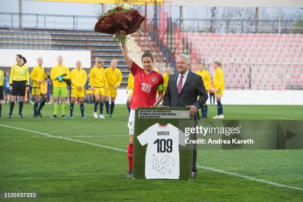 OeFB President Leo Windtner honors Nina Burger of Austria prior to the Women's international friendly between Austria and Sweden at BSFZ-Arena on...