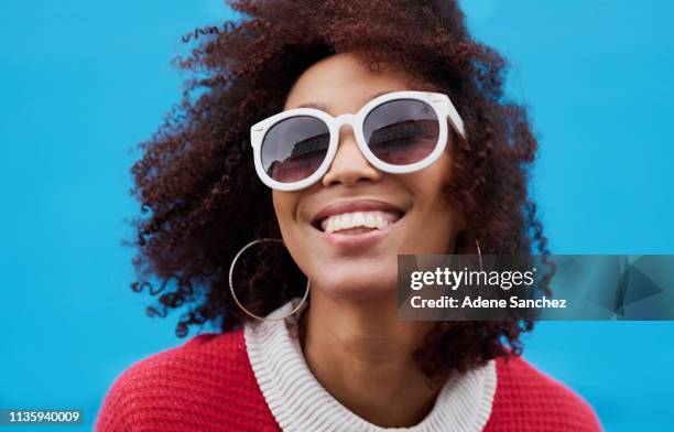 make them wonder why you're smiling - blue sunglasses stock pictures, royalty-free photos & images