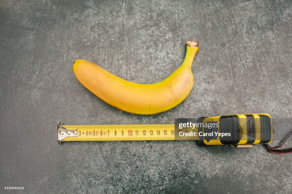 Measure tape and banana.Size matters