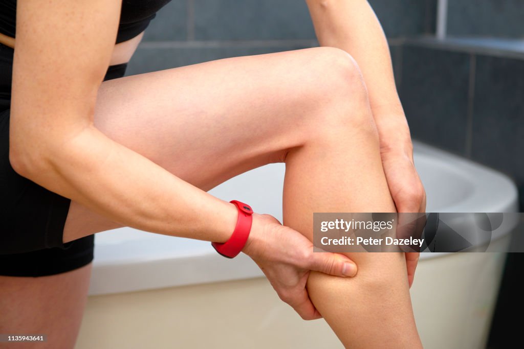 Massaging pain in leg after exercise