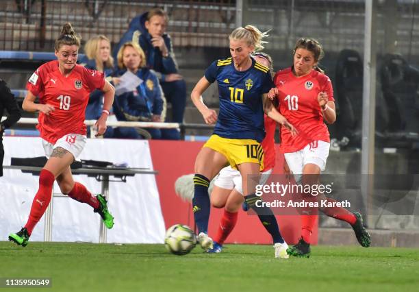 Sofia Jakobsson of Sweden is challenged by Laura Feiersinger of Austria during the Women's international friendly between Austria and Sweden at...