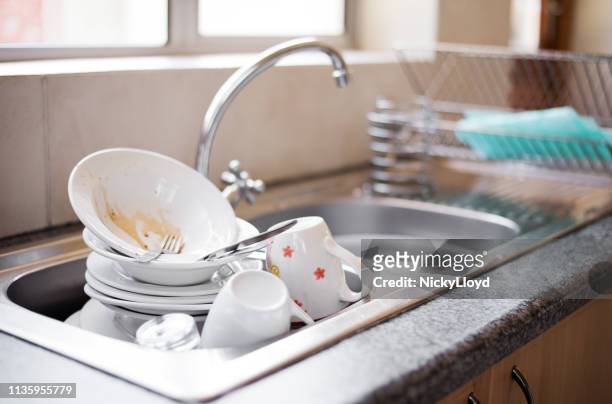 dirty dishes in the sink - stack of plates stock pictures, royalty-free photos & images